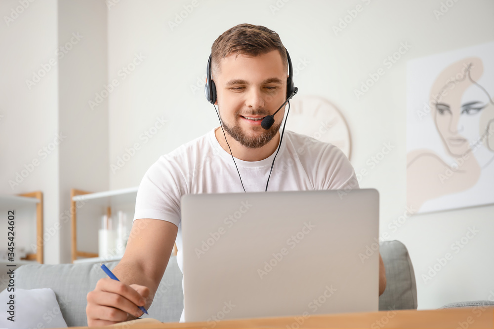 Male technical support agent working at home