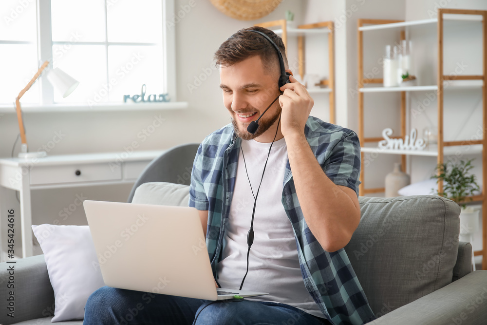 Male technical support agent working at home