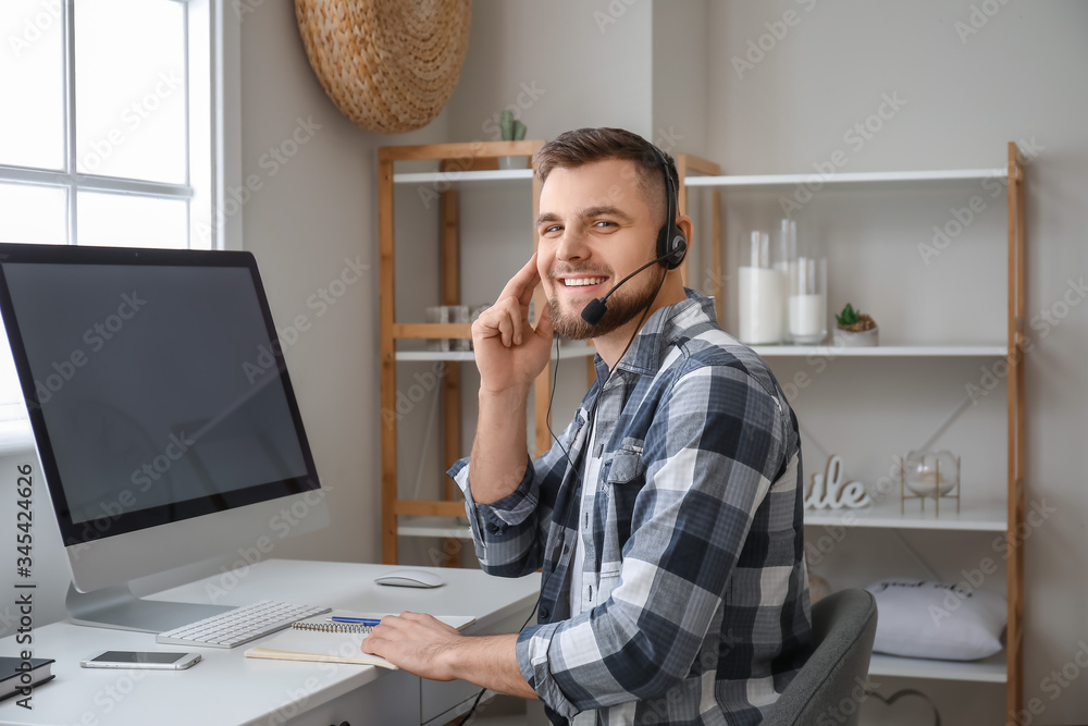 Male technical support agent working at home