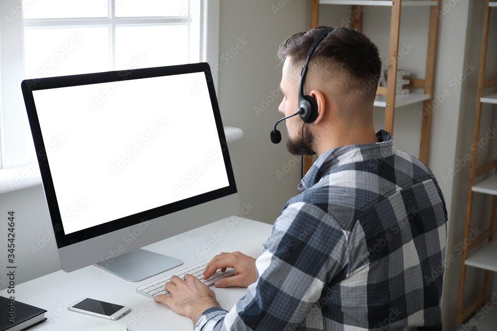 Male technical support agent working at home