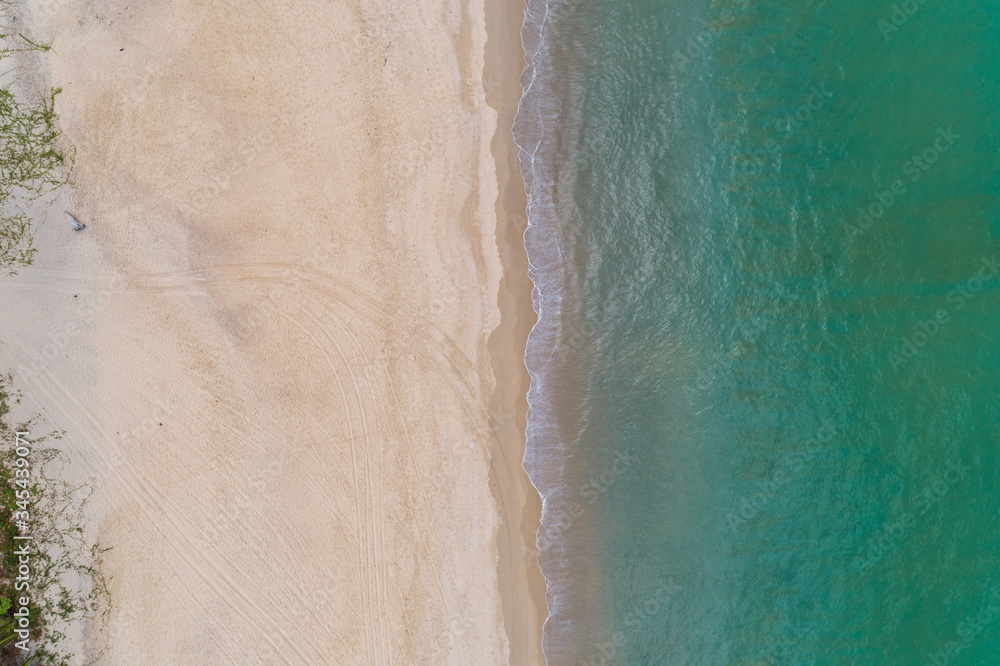 Aerial view Top down of beautiful tropical beach Aerial drone shot of turquoise sea water surface at