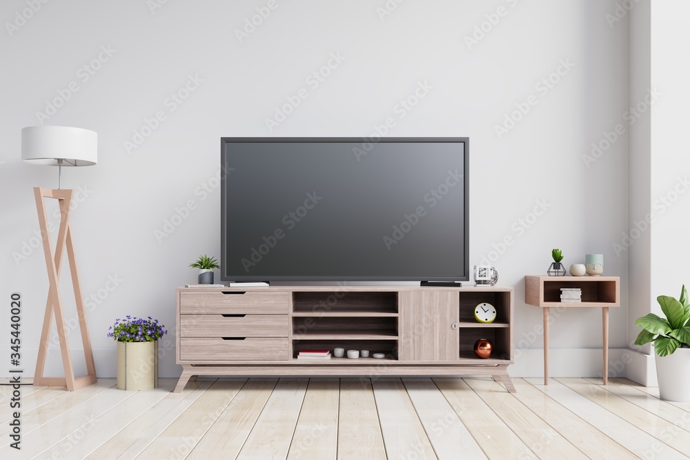 TV on the cabinet in modern living room on white wall background.