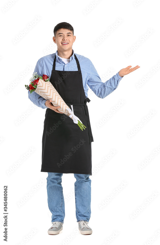 Portrait of Asian male florist with bouquet showing something on white background