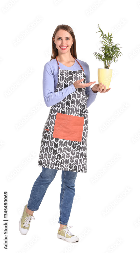 Portrait of female florist with plant on white background