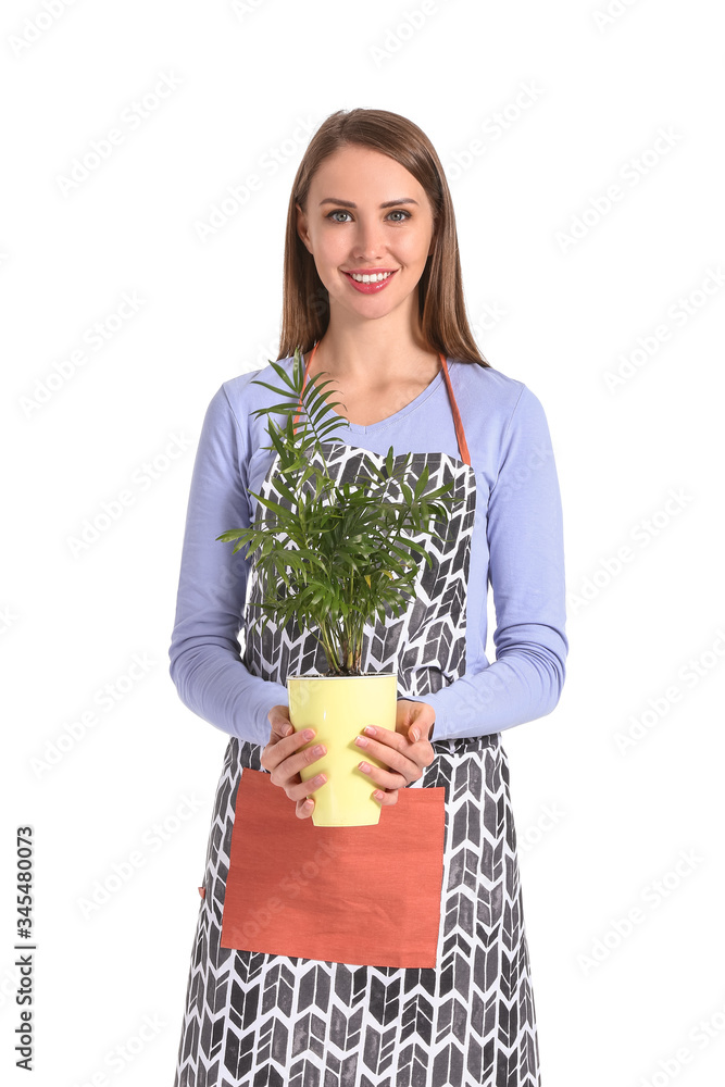 Portrait of female florist with plant on white background