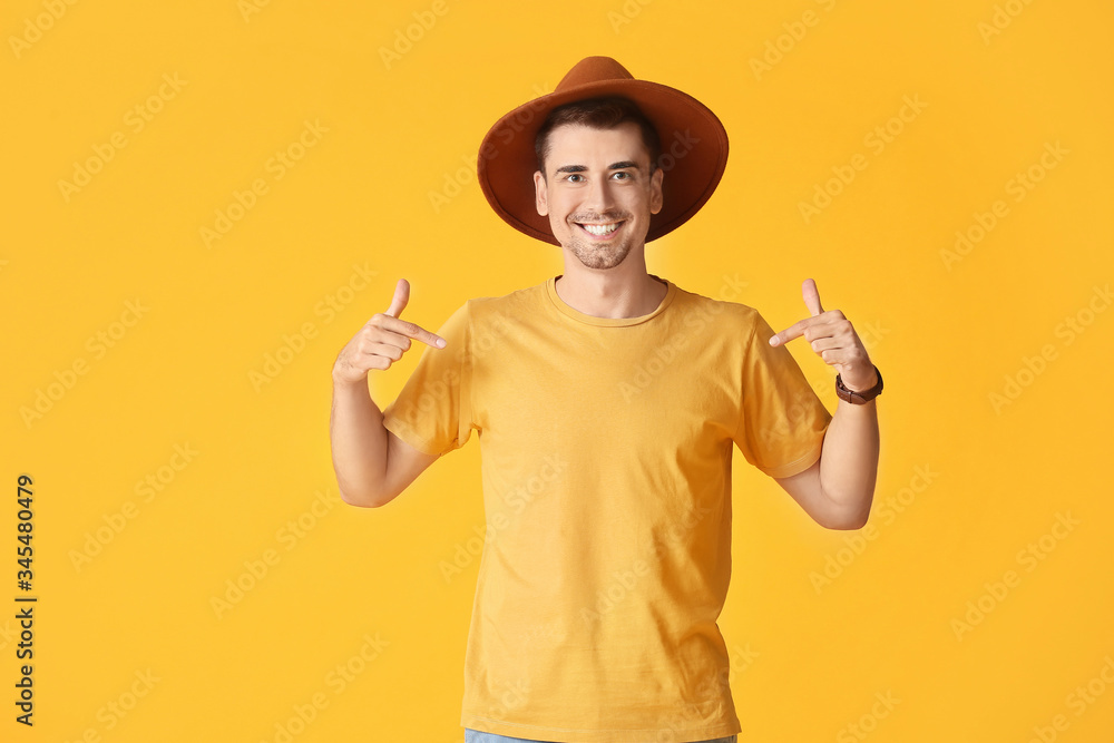 Man in stylish t-shirt on color background