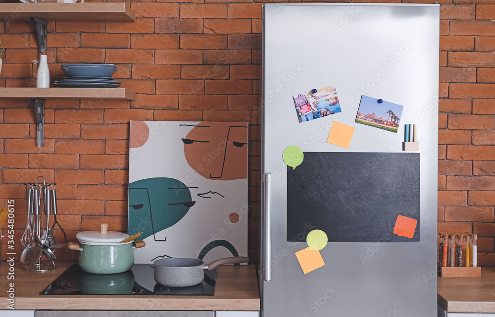 Chalkboard on door of refrigerator in kitchen