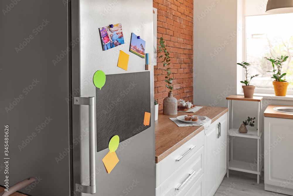 Chalkboard on door of refrigerator in kitchen