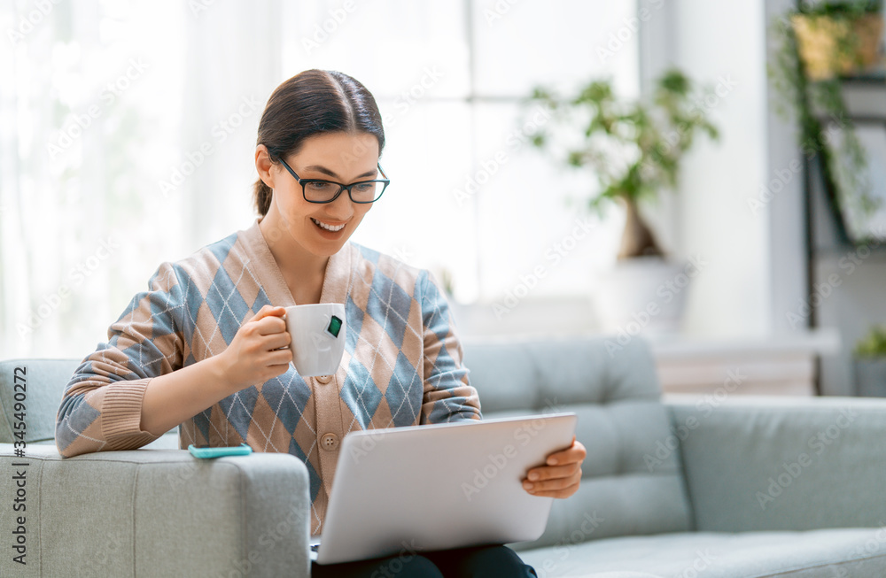 woman working on a laptop at home.