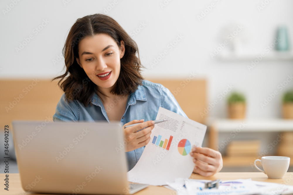 woman working on a laptop at home.