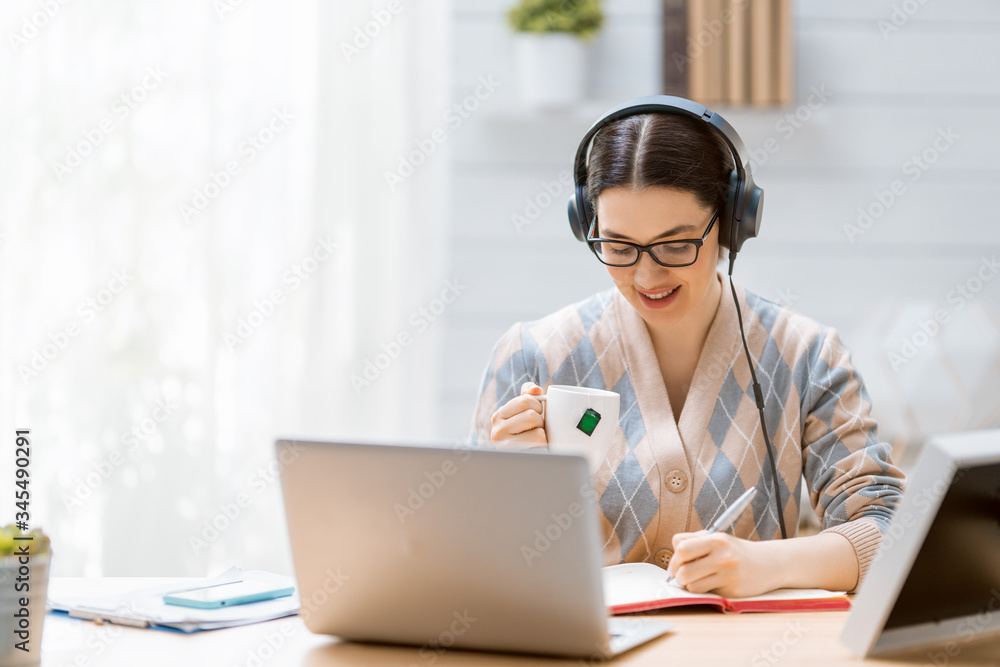 woman working on a laptop at home.