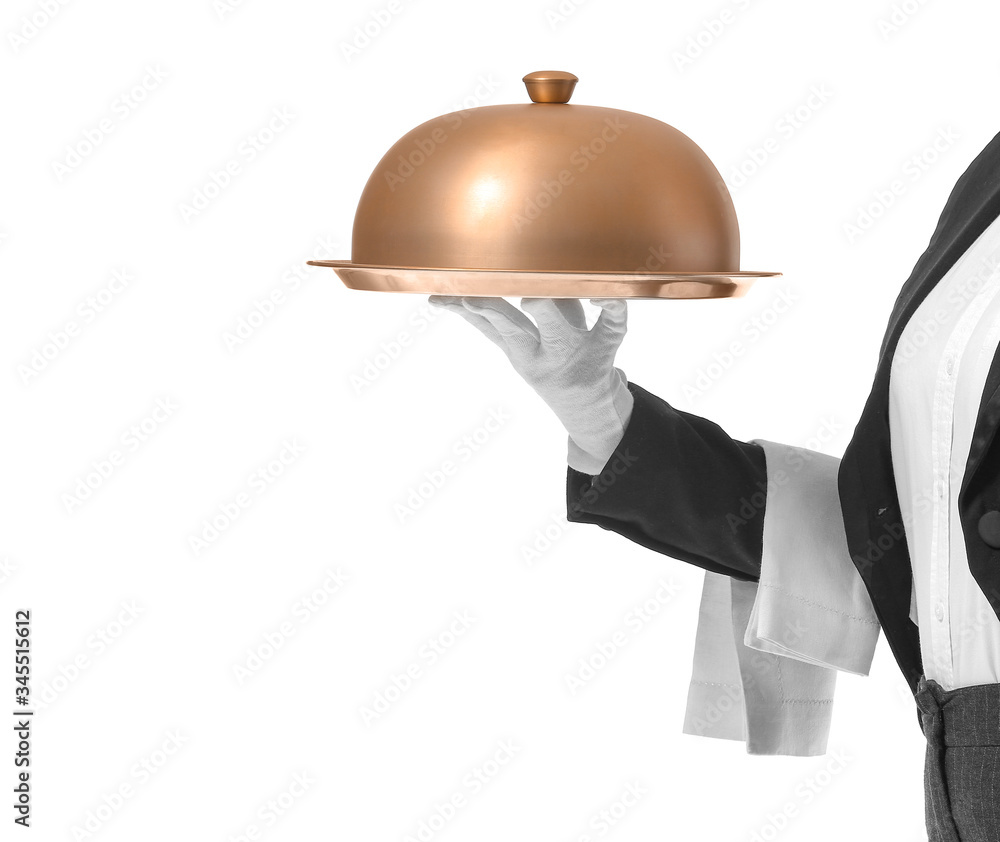 Beautiful female waiter with tray and cloche on white background