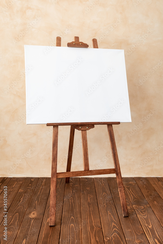 Wooden easel with canvas blank in studio