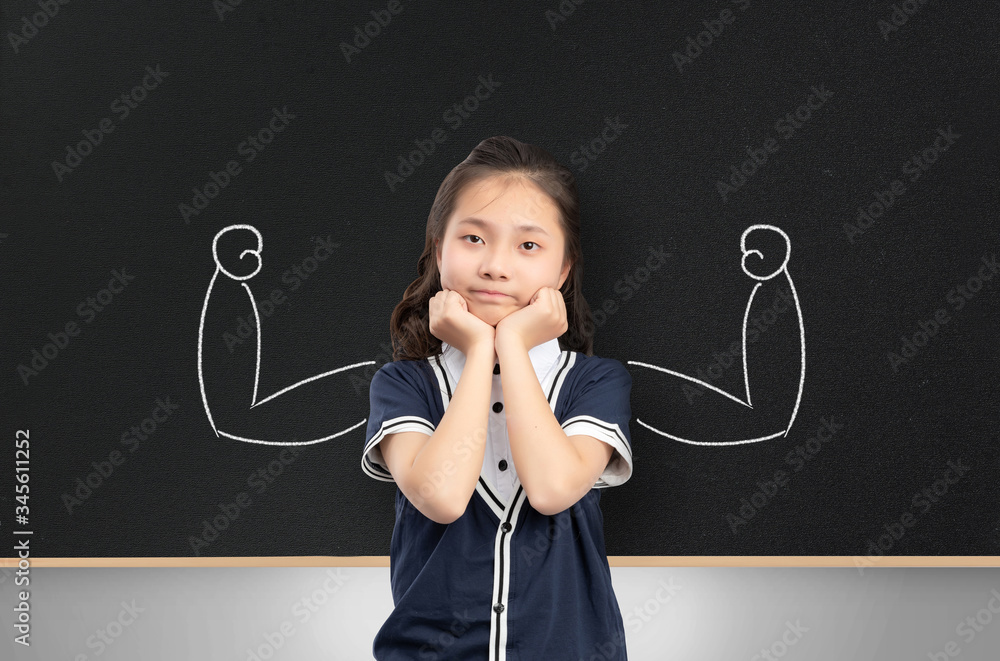 Asian girl in front of the blackboard

