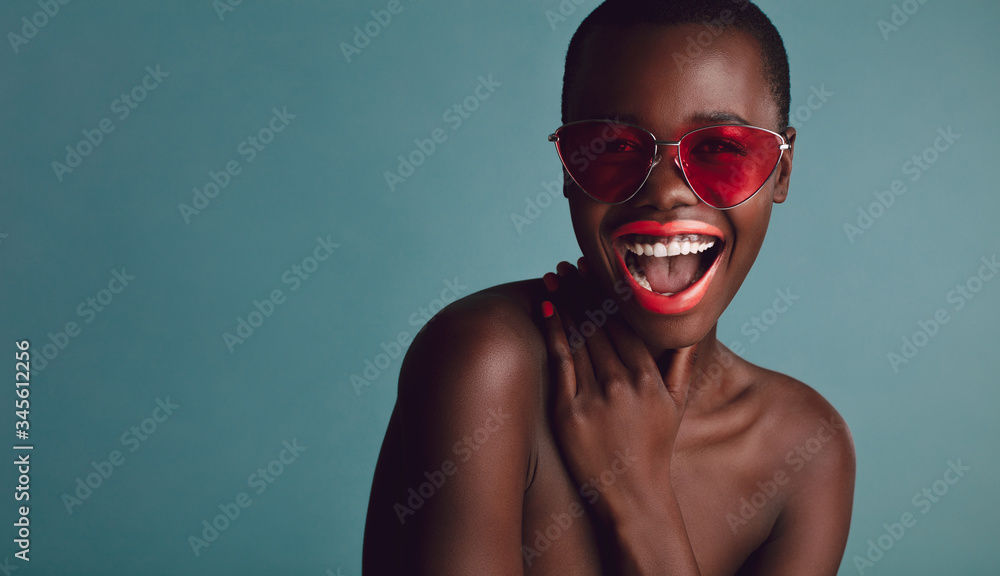 Cheerful woman with colorful makeup