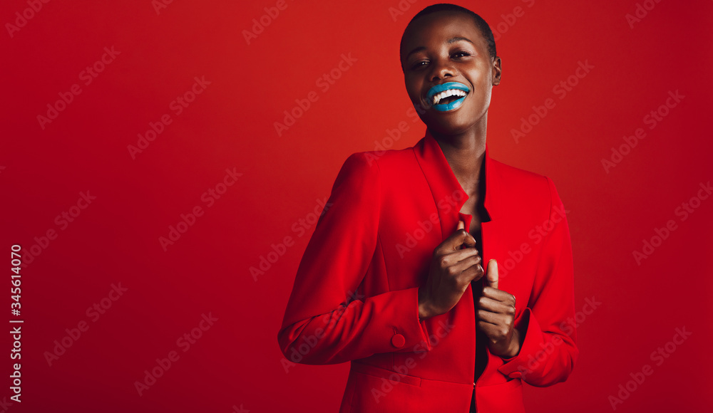 Fashionable woman looking at camera and smiling