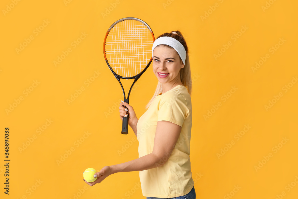 Portrait of beautiful tennis player on color background