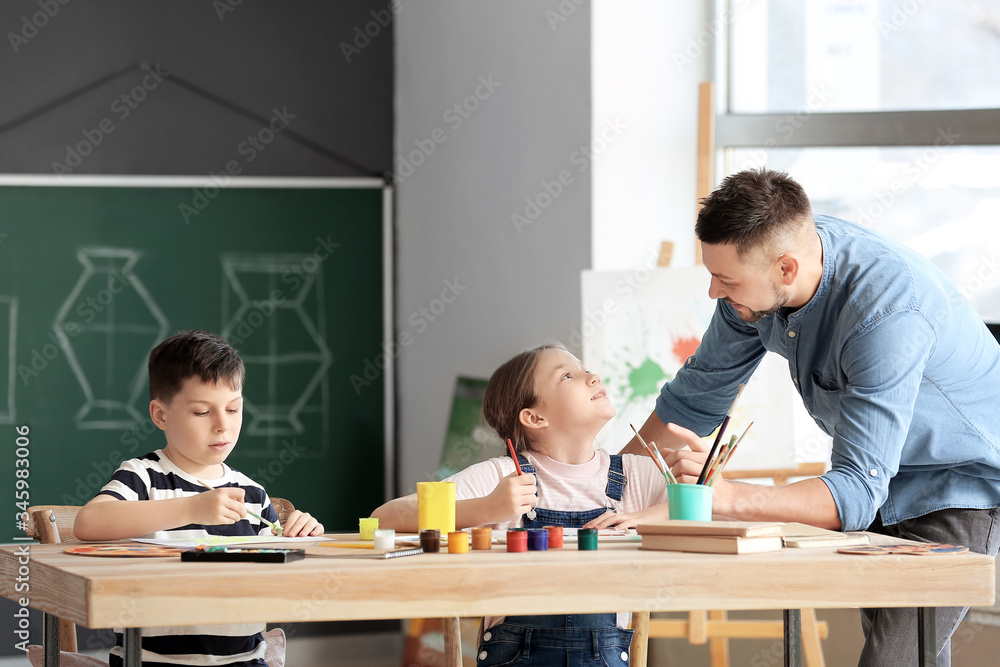 Drawing teacher giving optional classes at school