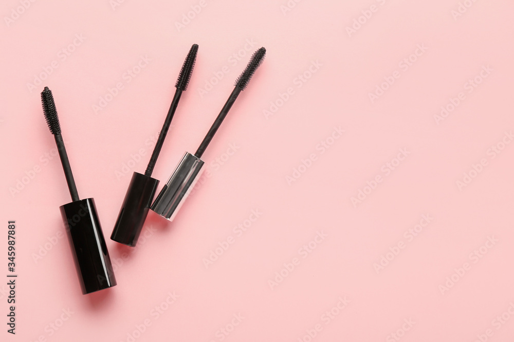 Black mascara on color background