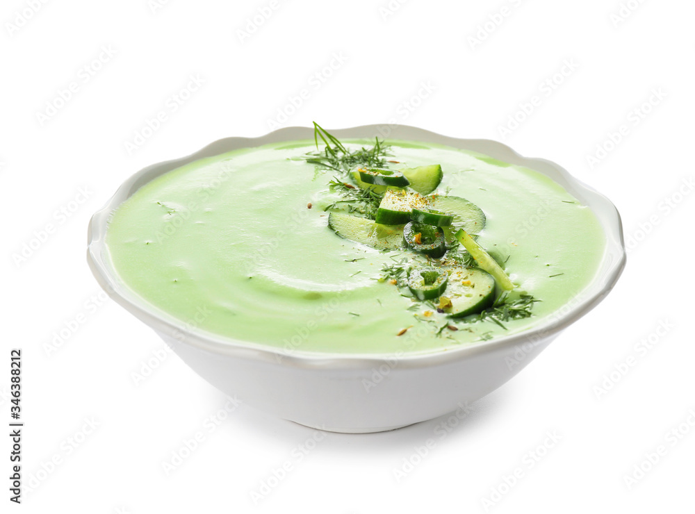 Bowl with cold cucumber soup on white background