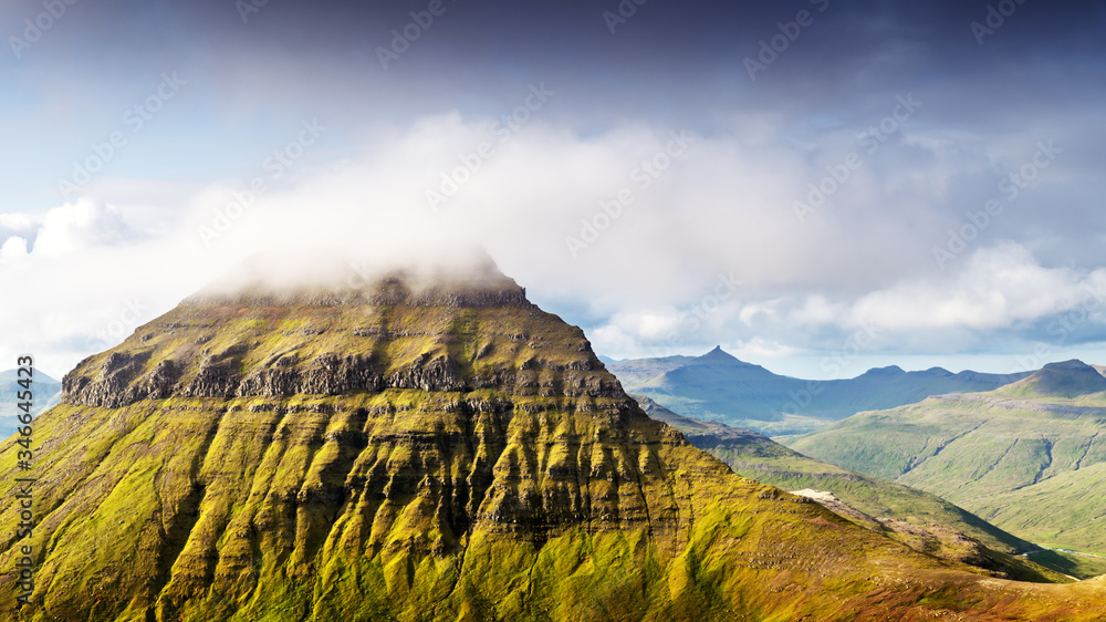 Foggy mountain peaks and clouds covering sea and mountains. Panoramical view from famous place - Sor