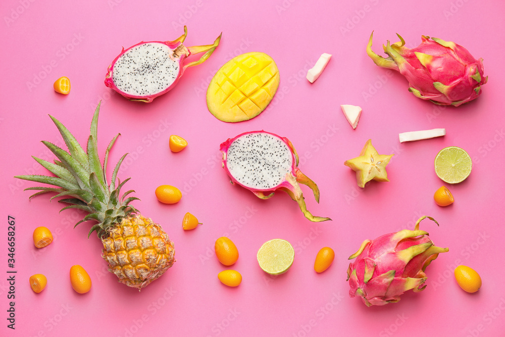 Tasty exotic fruits on color background