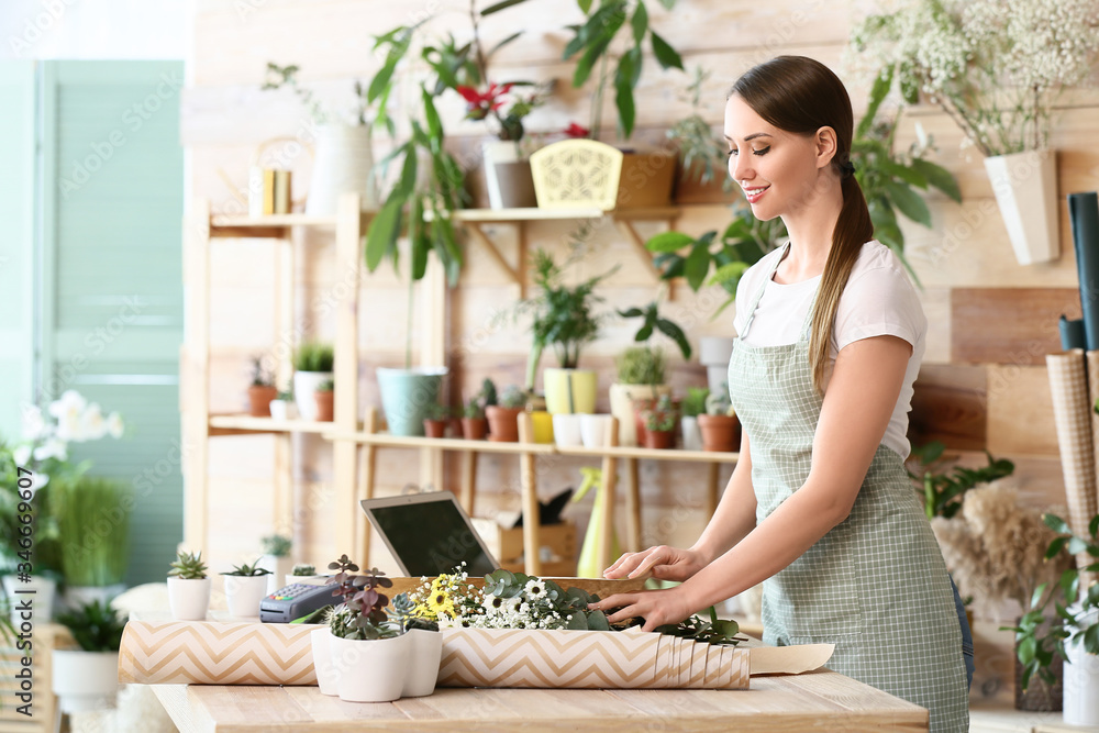 Female florist working in shop