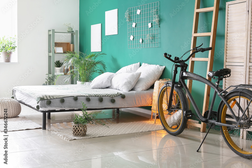 Interior of modern bedroom with bicycle