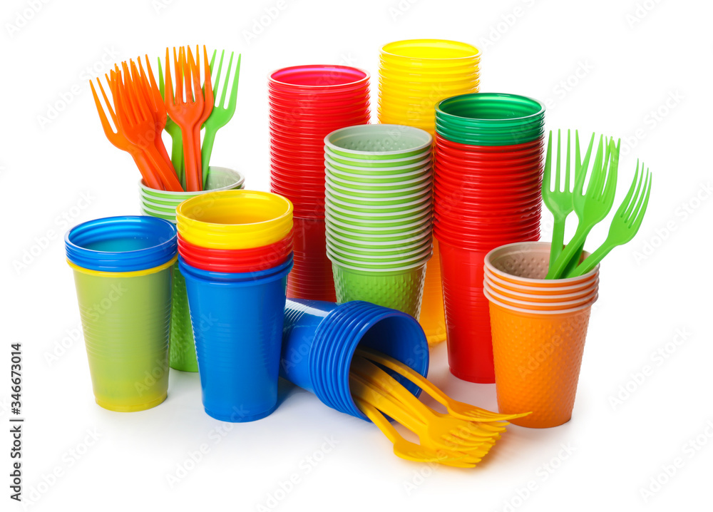 Set of plastic tableware on white background