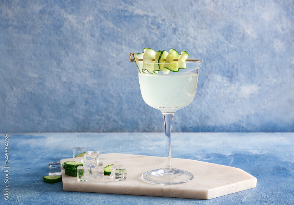 Glass of tasty cucumber martini on table