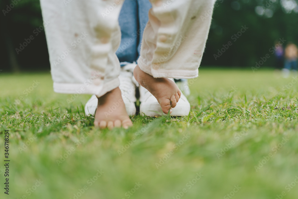 baby walking on grass