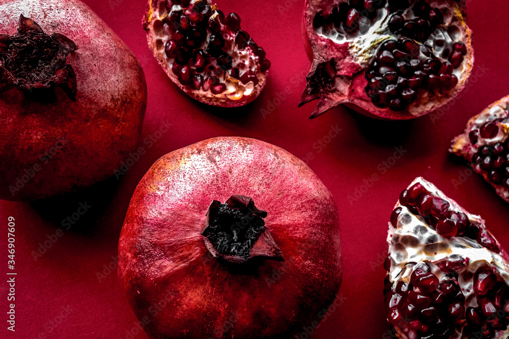 Ripe fresh fruit on red background top view