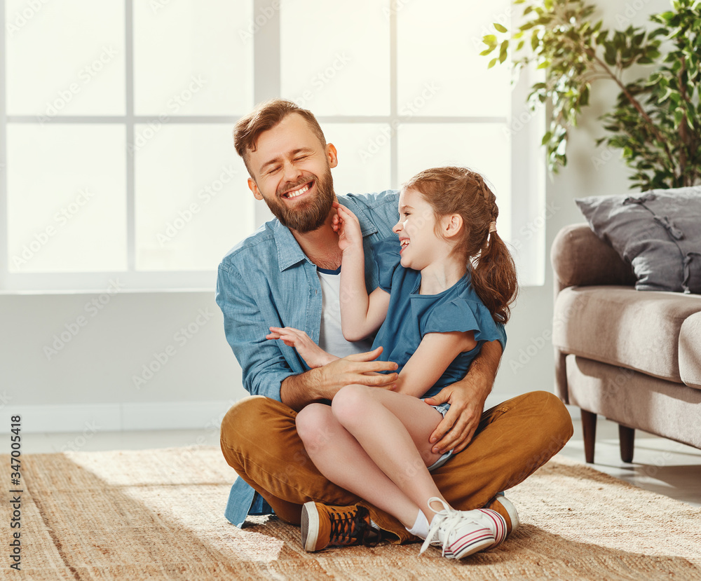 Father and daughter having fun at home.