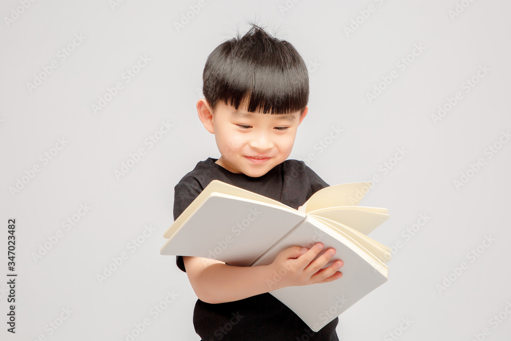 Asian boy on grey background

