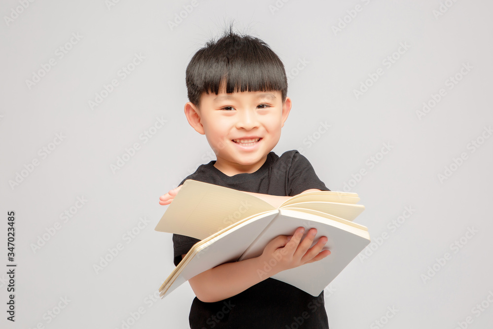 Asian boy on grey background

