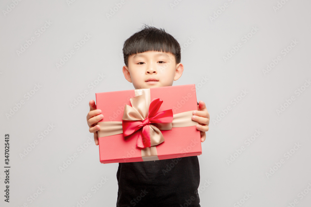 Asian boy on grey background

