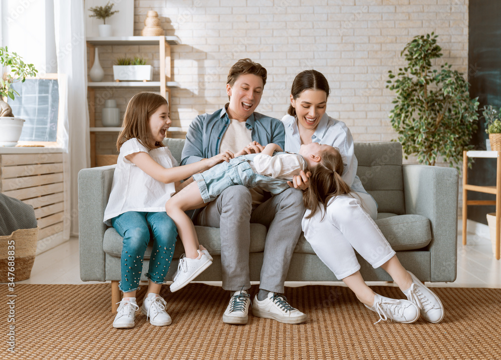 Two children with mother and father.