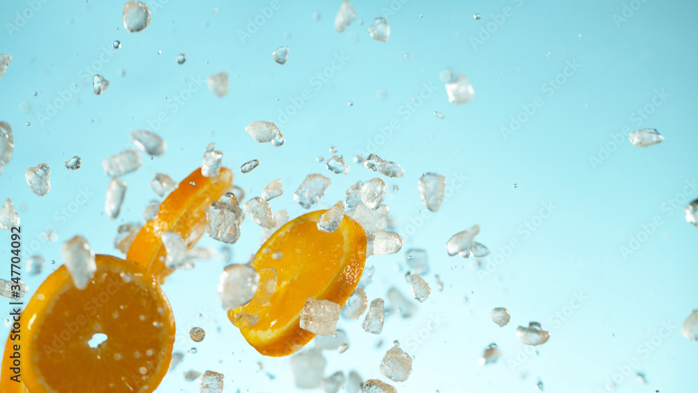 Freeze Motion of flying orange slices with ice