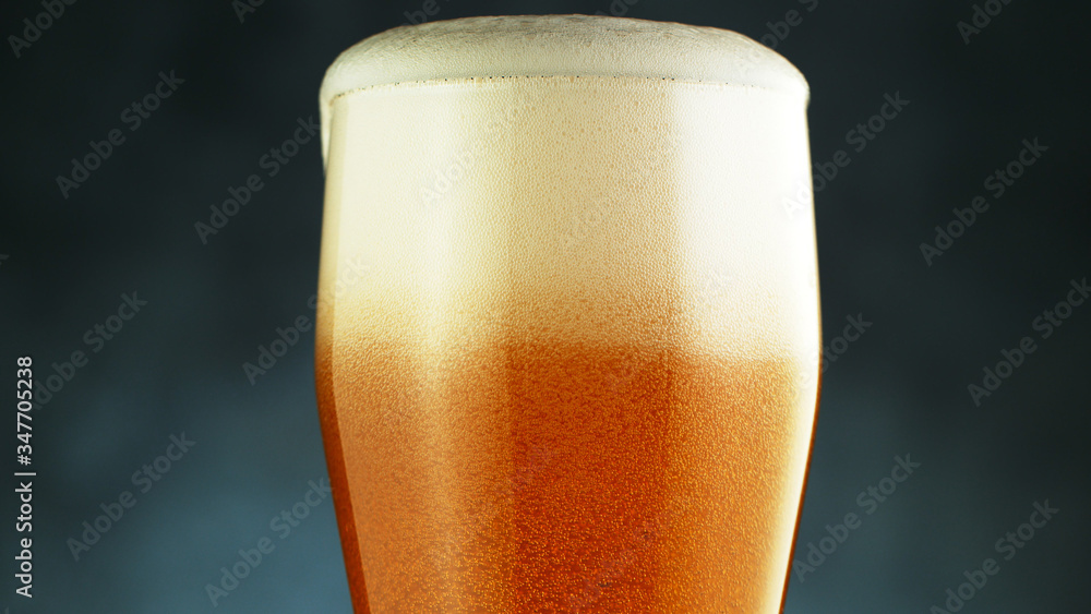 Close up of a wet pint of cold pale beer