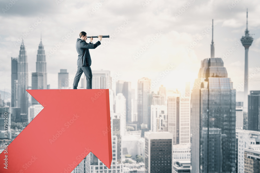 Businessman standing on abstract red arrow