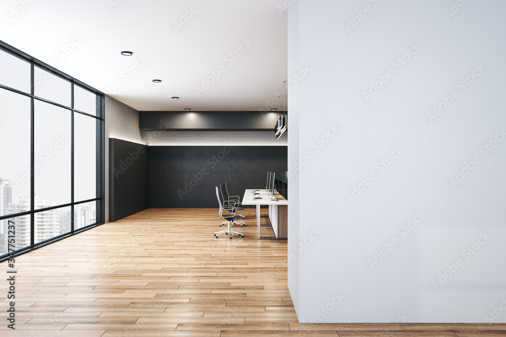 Modern office interior hall with computer and blank wall.