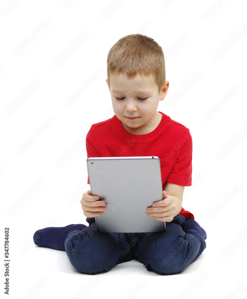 little boy looking at digital tablet computer