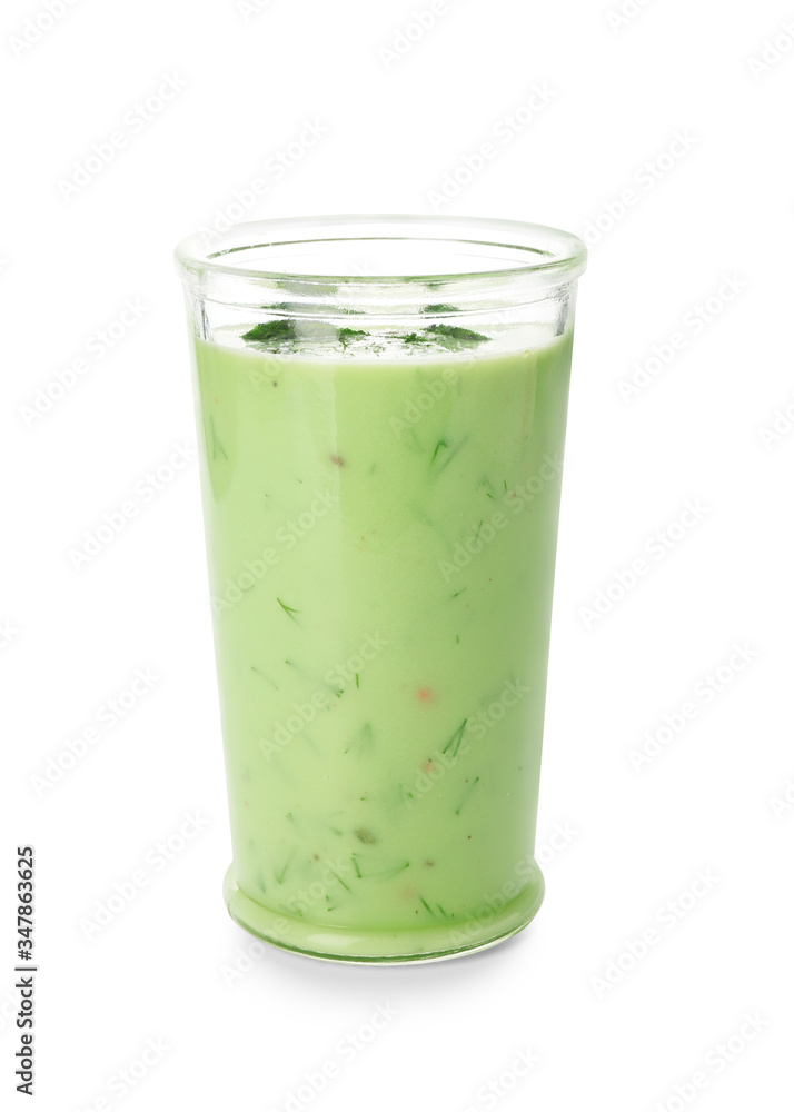 Glass with cold cucumber soup on white background