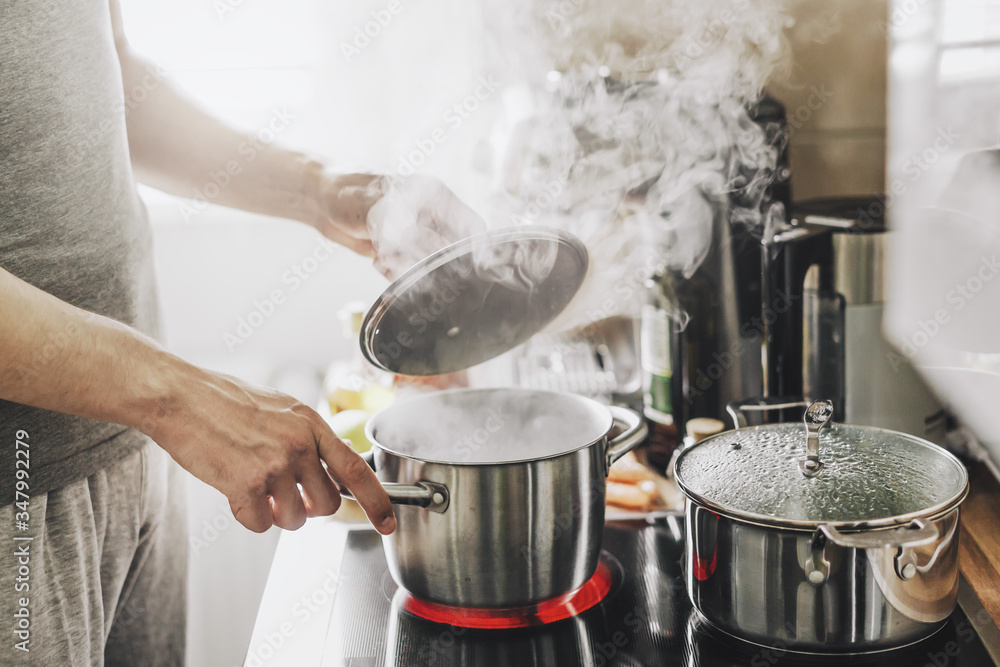 Man cooking fresh food at home