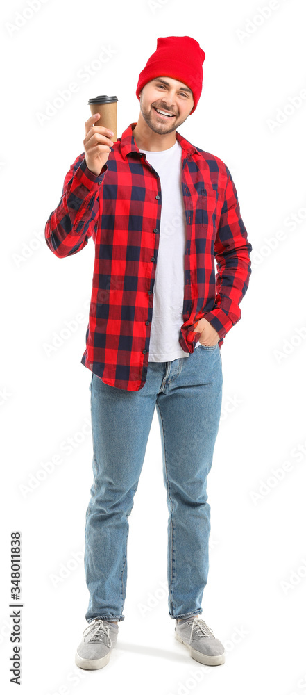 Young man with cup of hot coffee on white background