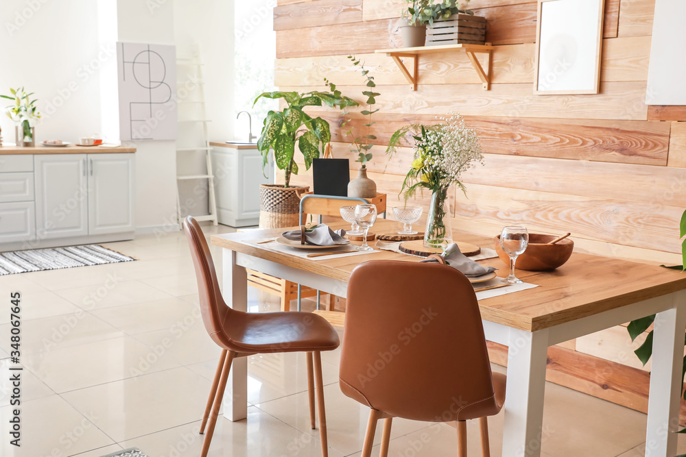 Interior of modern stylish dining room with floral decor