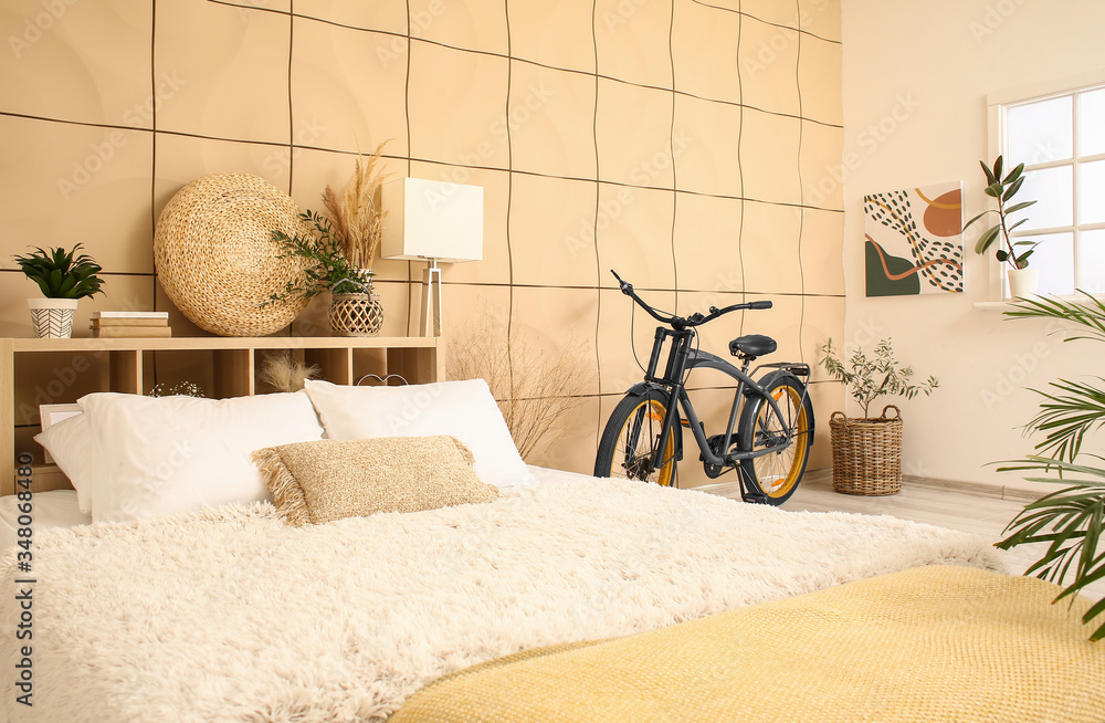 Interior of modern bedroom with bicycle