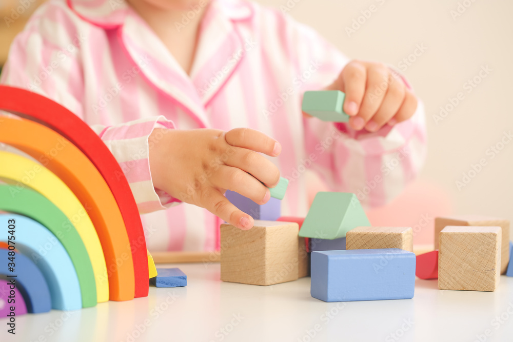 Little girl playing at home, closeup