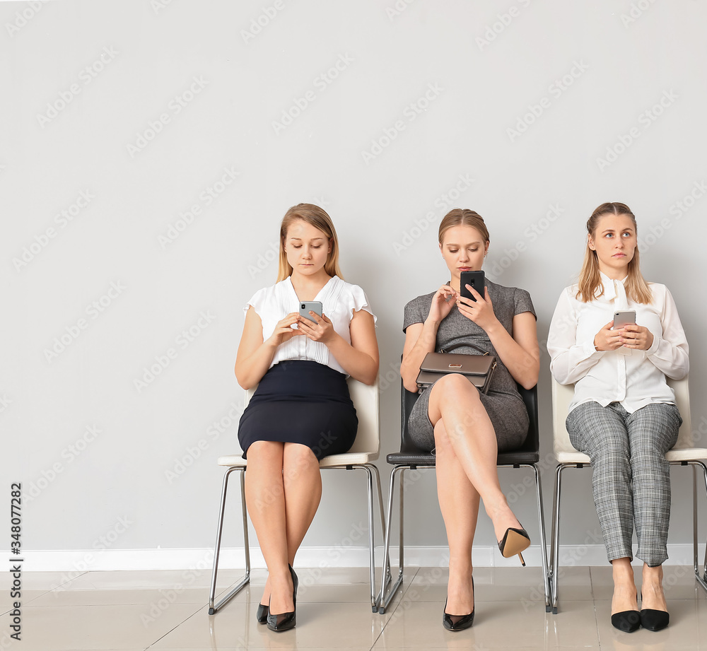 Business people waiting in line indoors