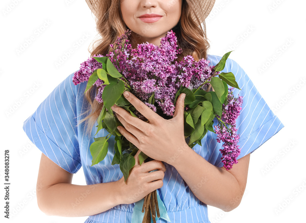 Beautiful young woman with bouquet of lilac flowers on white background